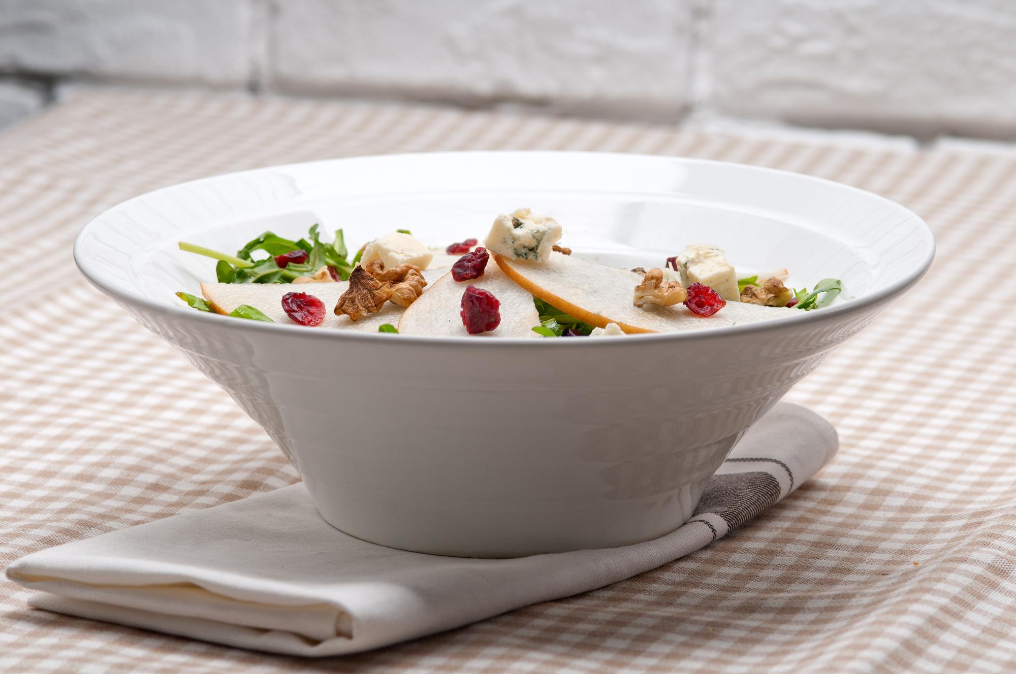 Plated seasonal salad in ceramic bowl